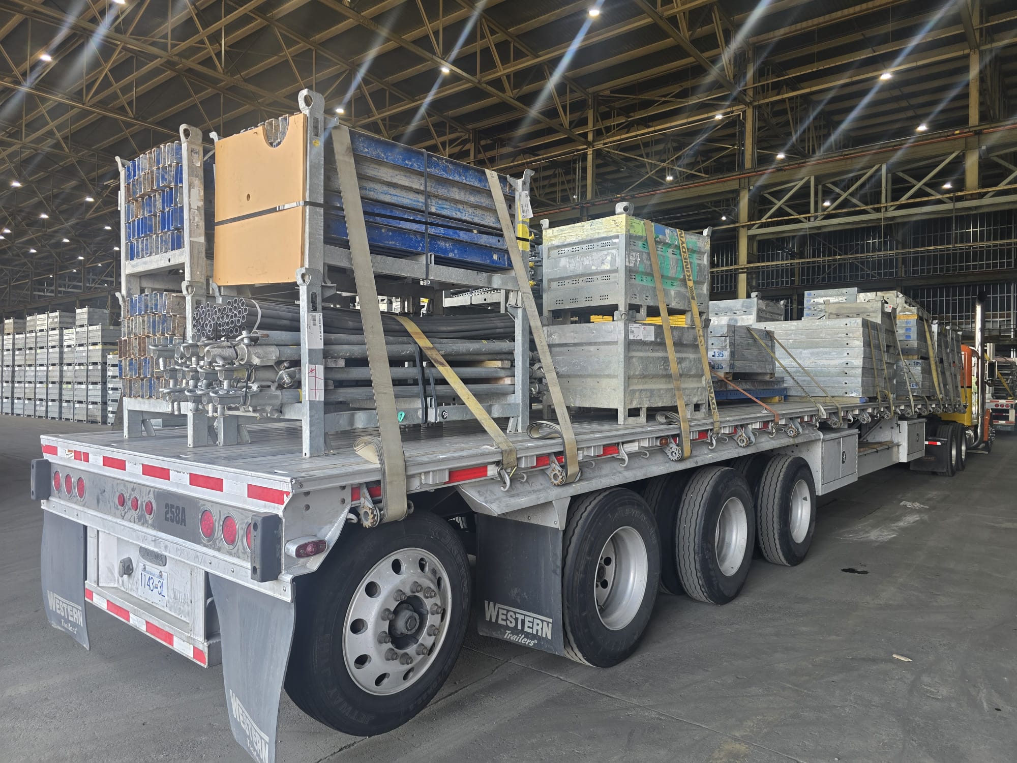 Construction formwork and materials staged on a flatbed
